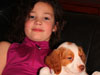 photo: Molly holding Rebel on sofa